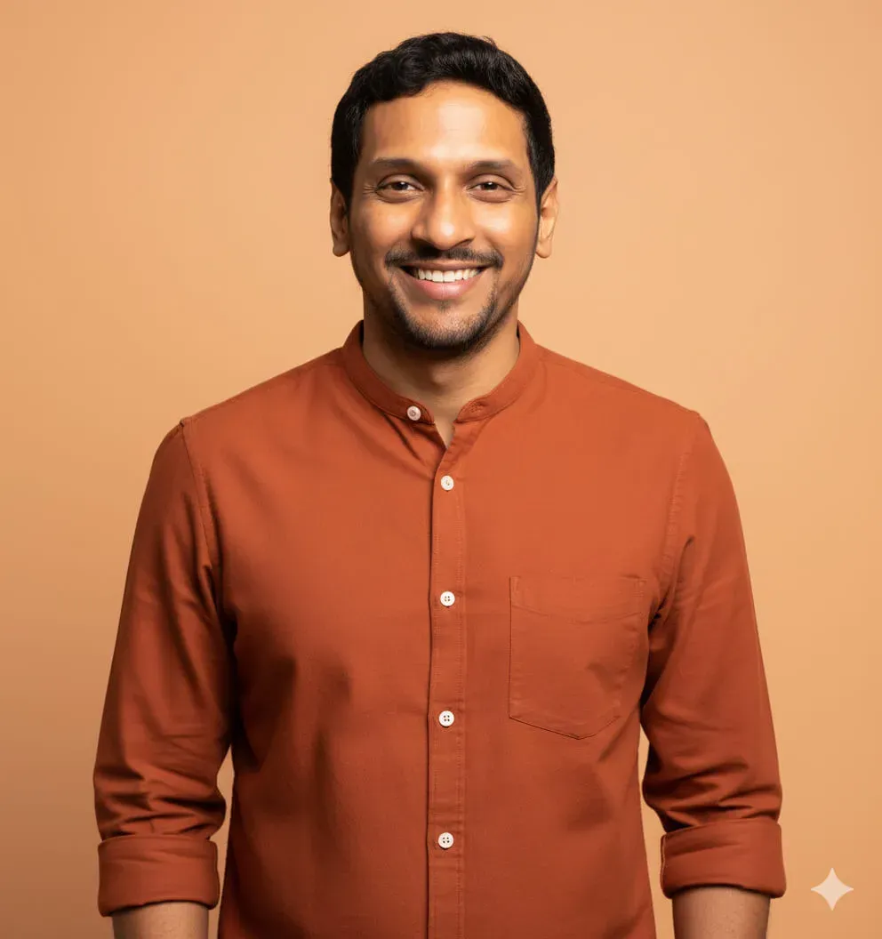 A person wearing a burnt orange button-down shirt with mandarin collar and white buttons. Image generated using Nano Banana.